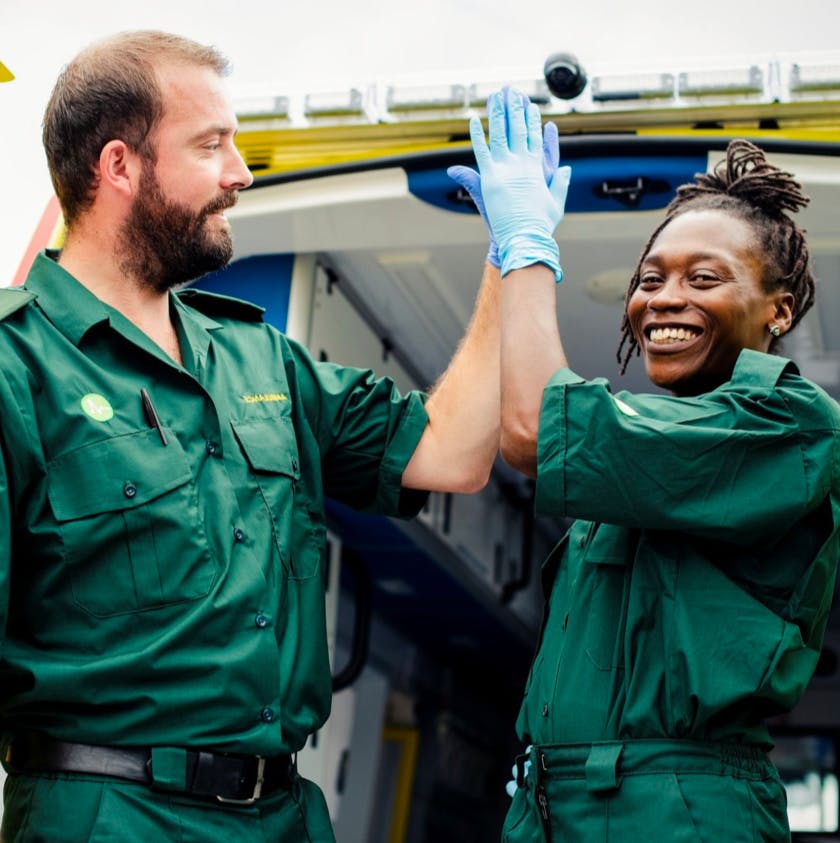 two first responders high fiving