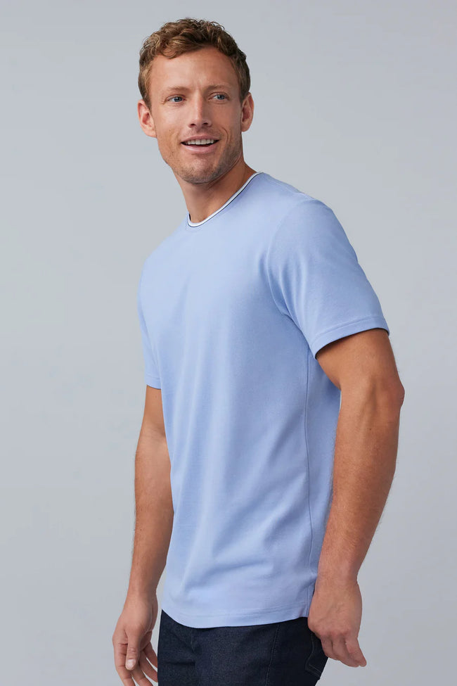 Man standing in a baby blue SILVER pique crew shirt