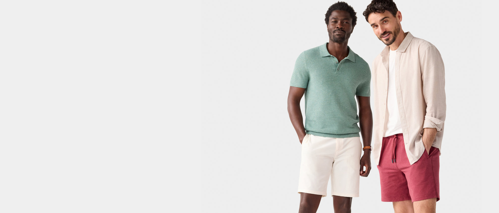 Two guys standing in various Mack Weldon products