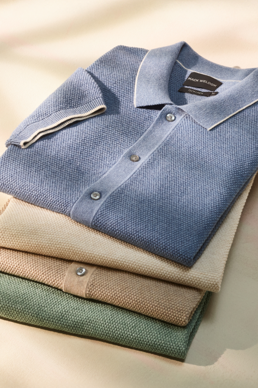 Various colors of Tech Linen Button Up Sweater Polo 