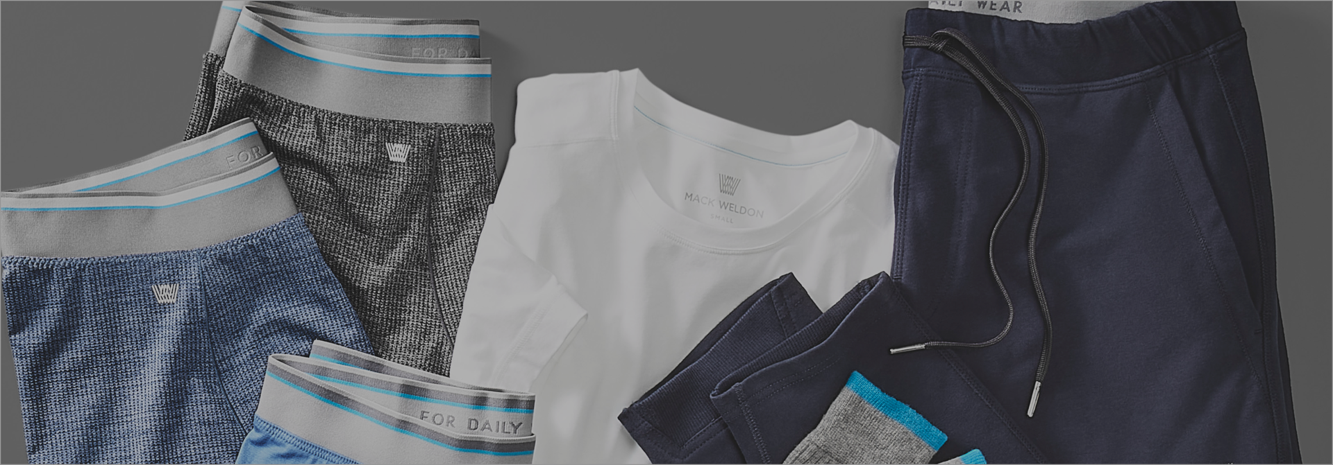 Lay down of Mack Weldon boxer briefs, crew neck t-shirt, sweatpant, and socks