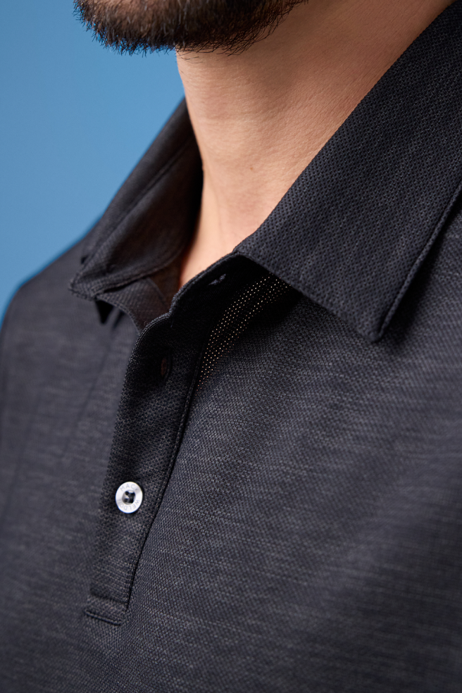 Detailed view of a man wearing Airknitx Polo