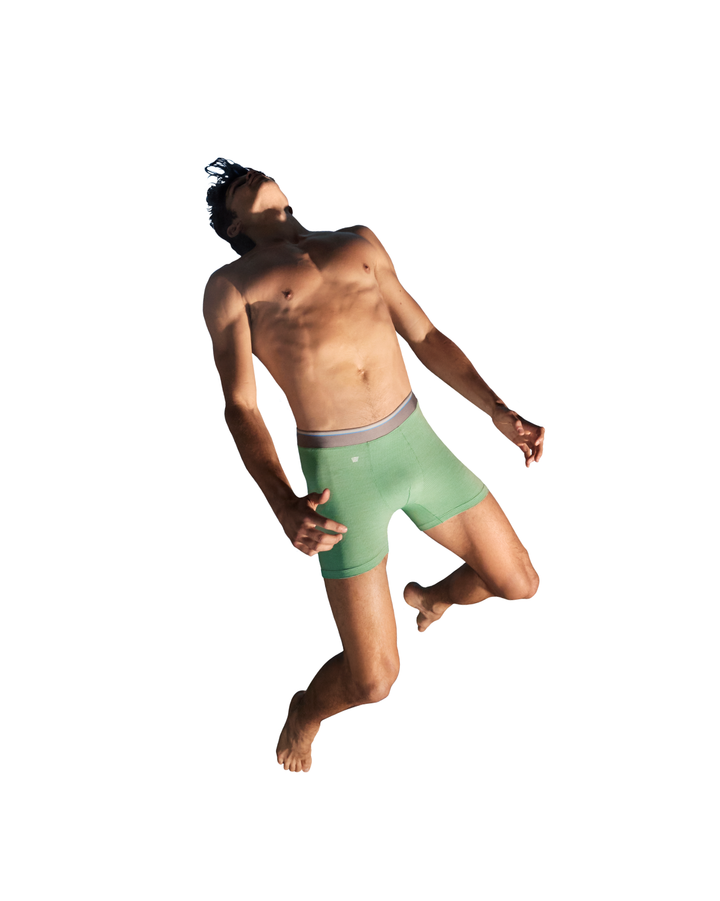 Image of a man jumping in the air wearing green boxer briefs