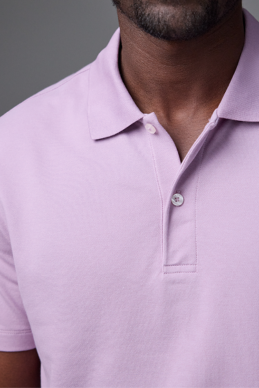 Detailed view of a man wearing Silver Pique Polo